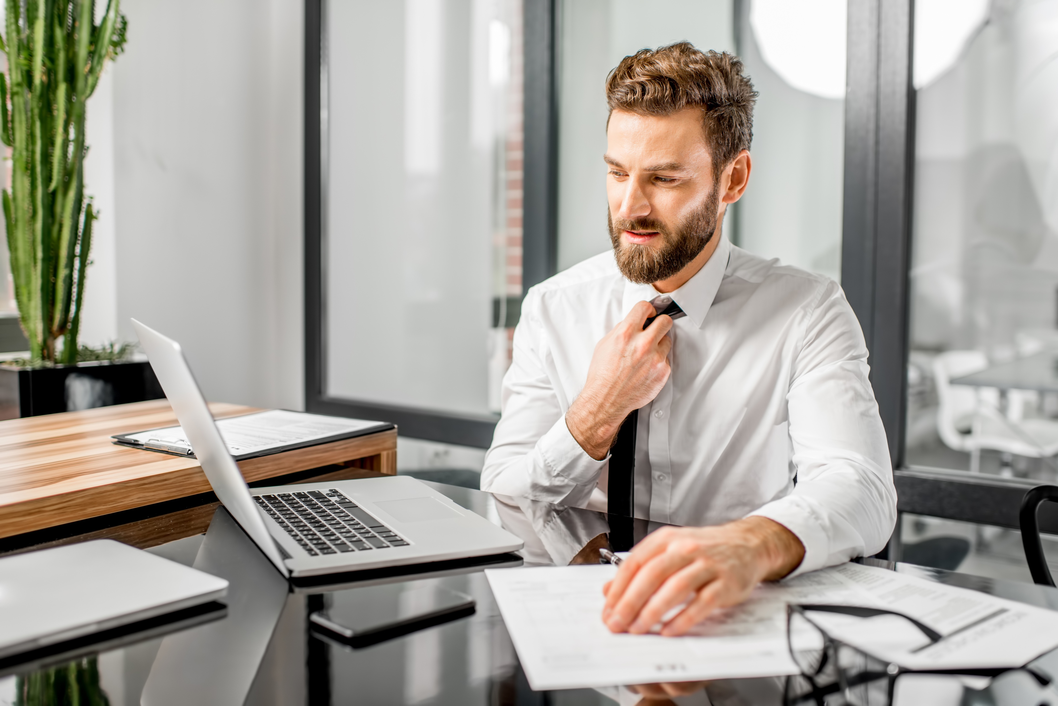 man sitting at desk in office