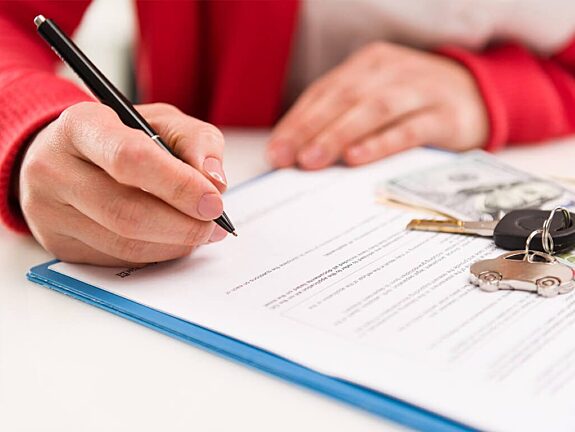 Red Woman Signing Important Paper And Keys