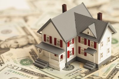 Model House Sitting on Money
