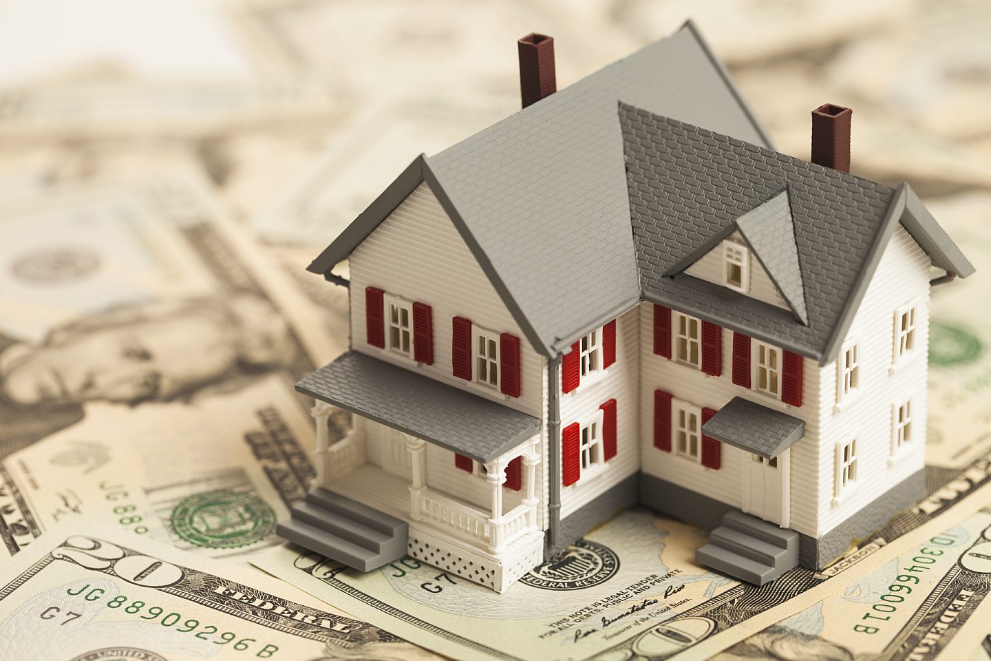 Model House Sitting on Money