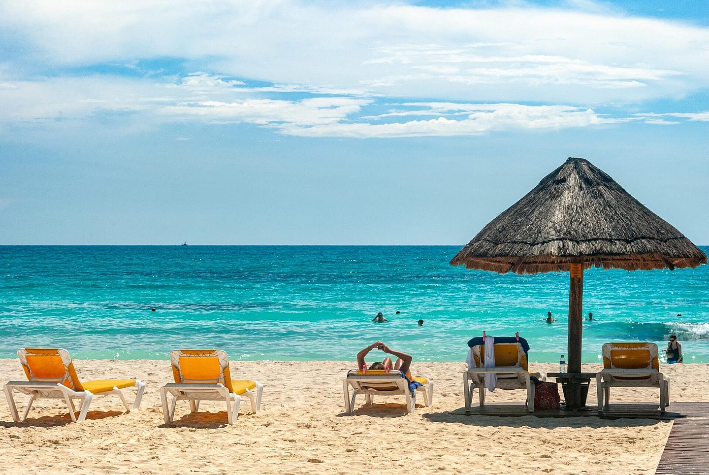 Table and Chairs in Sand on A Beach