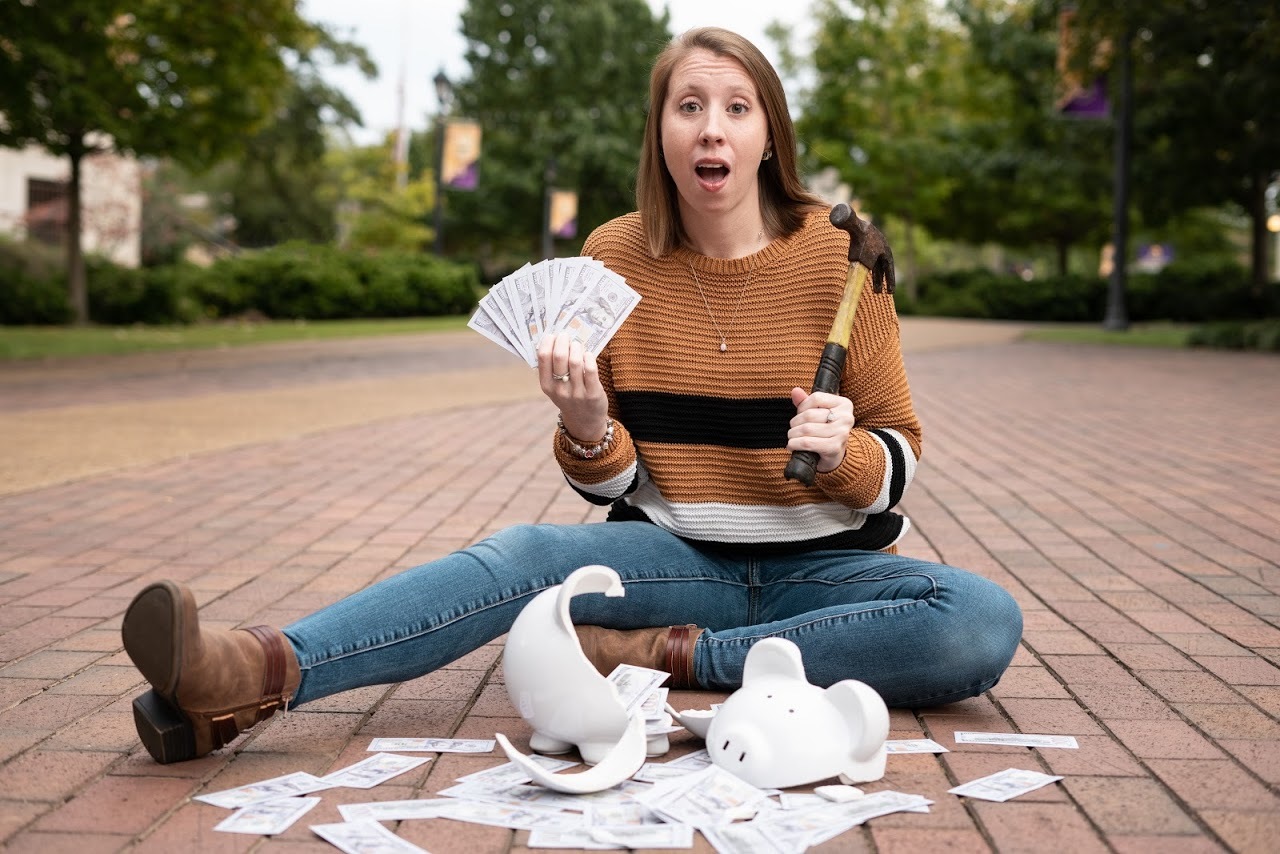 Hannah Breaking Piggy Bank